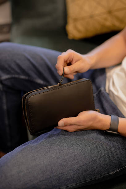 istock Man unfasten his leather wallet 1334597106
