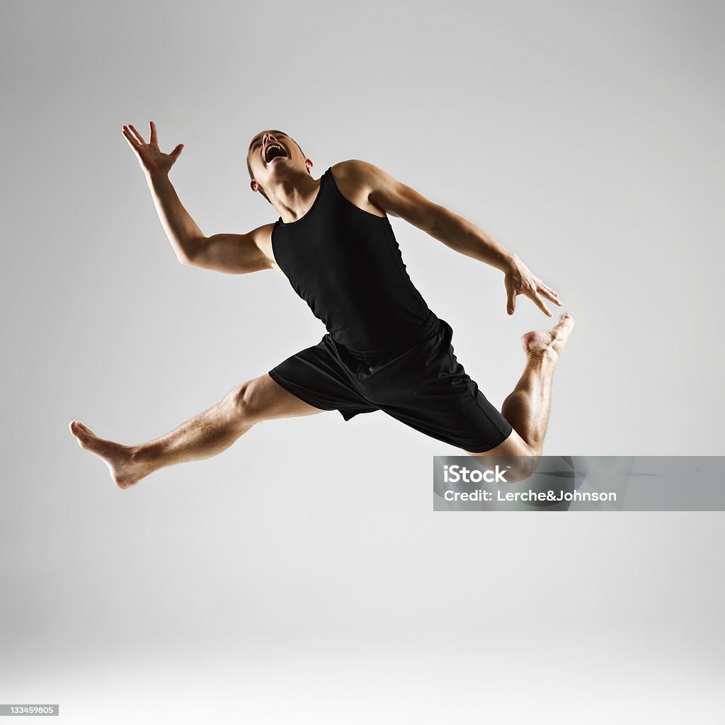 Young man jumping Young man jumping with power Active Lifestyle Stock Photo