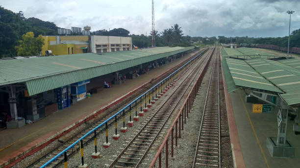 istock An empty railway station and tracks on a rainy day, Hassan, Karnataka India 1334598084