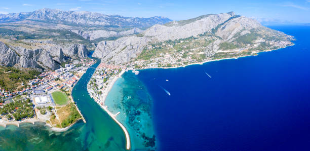 Omis Town Panorama Panoramic aerial view of the old Croatian town of Omis and the river Cetina, which flows into the Adriatic Sea adriatic sea stock pictures, royalty-free photos & images