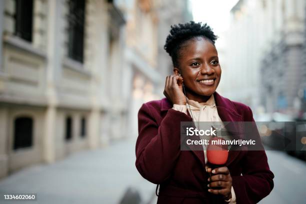 African Female News Reporter In Live Broadcasting Stock Photo - Download Image Now - Journalist, Newscaster, Journalism