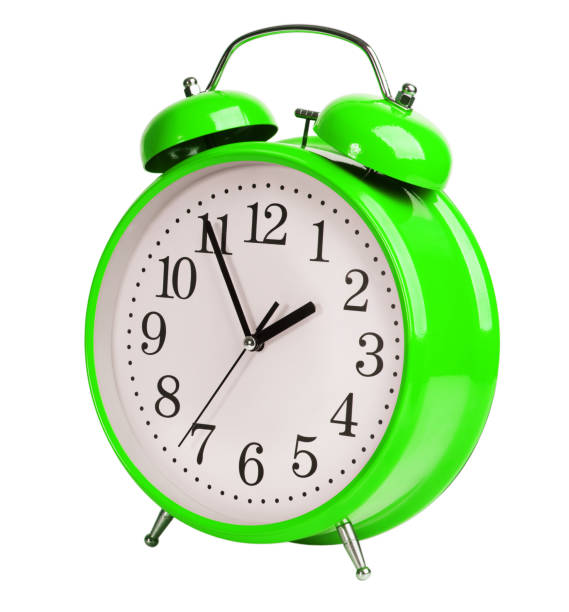 Iron green alarm clock on white background