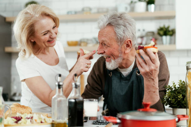 istock Senior couple eating breakfast together in the kitchen 1334602691