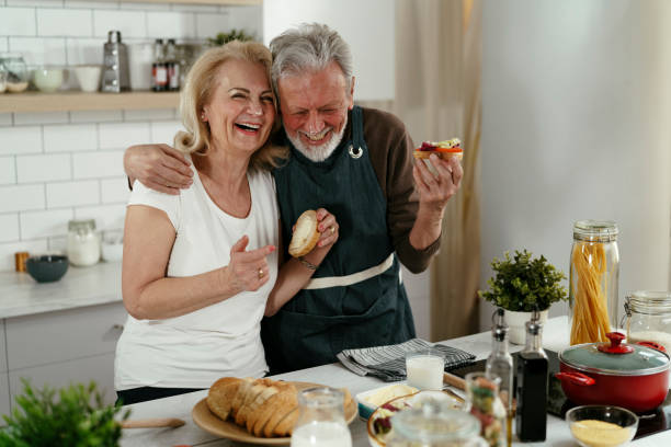 istock Senior couple eating breakfast together in the kitchen 1334602955