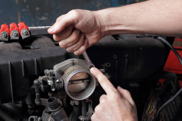 istock Car service - Engine  repair mechanic hands with wrench 1334603199
