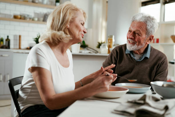 istock Senior man eating lunch together. 1334604643