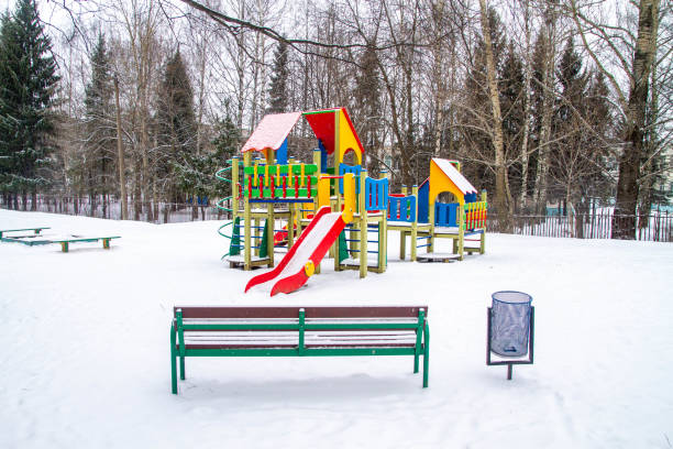 istock New bright multi-colored Playground in winter. Snow. Russia 1334606261