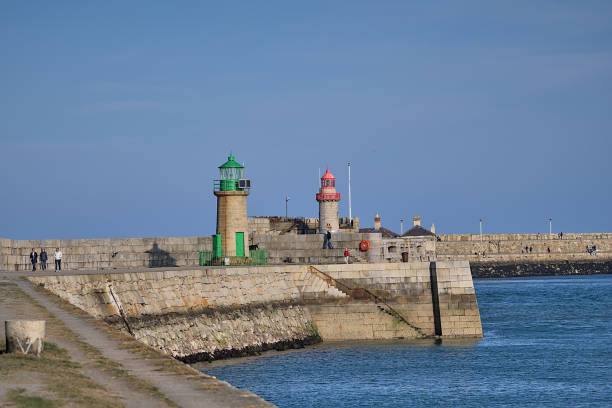Evening view of red and green East and West Pier lighthouses in Dun Laoghaire harbor stock photo