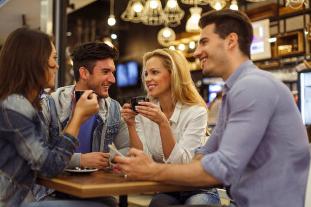 istock Two couples having a double date at the coffee shop 1334609017