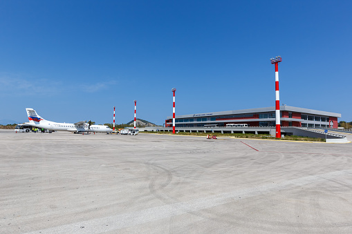 Zakynthos, Greece - September 21, 2020: Sky Express ATR 72-500 airplane and Terminal of Zakynthos airport (ZTH) in Greece.