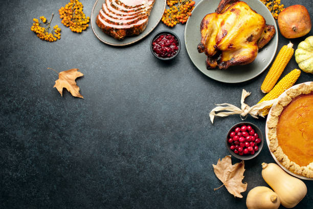 Thanksgiving traditional food for festive charity or family and friends dinner party, top-down view stock photo