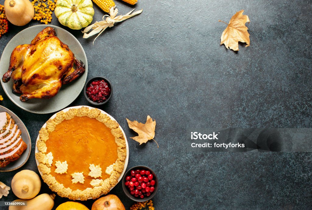 Thanksgiving traditional food for festive charity or family and friends dinner party, top-down view Thanksgiving traditional food for festive charity or family and friends dinner party, top-down view, blank space for a greeting text Thanksgiving - Holiday Stock Photo
