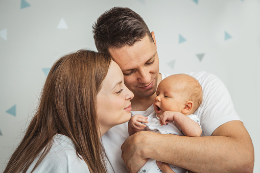 Happy family with newborn baby