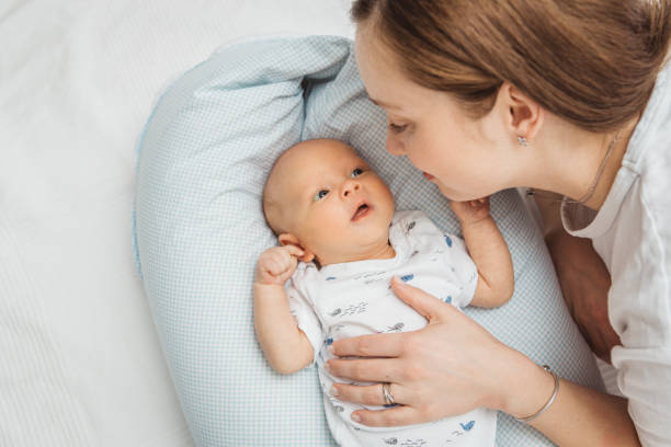 istock Mother holding  her newborn baby boy 1334611024