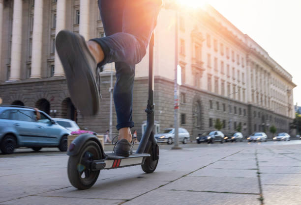 istock Man riding electric scooter in the morning 1334611362