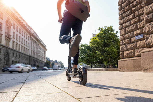 Man riding electric scooter in the morning
