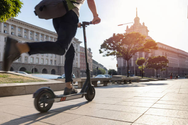 istock Man riding electric scooter in the morning 1334611370
