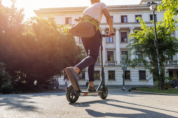 istock Man riding electric scooter in the morning 1334611652
