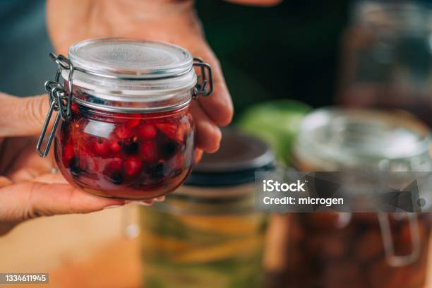 Person making cherry smoothie with a blender isolated Stock Photo