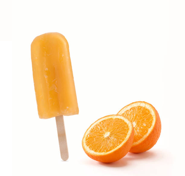 istock Orange popsicle stick and fruit. 1334612599