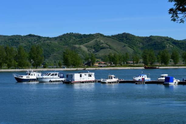 istock boats on a clear blue river 1334612674