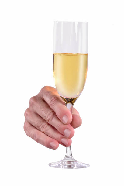 istock Cheers hand champagne glass 1334612941