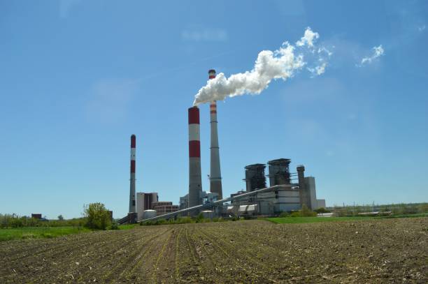 istock factory, and white smoke from the chimney 1334613201