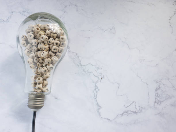 istock light bulb and alphabet wood cube on white marble for idea or think concept 1334615449