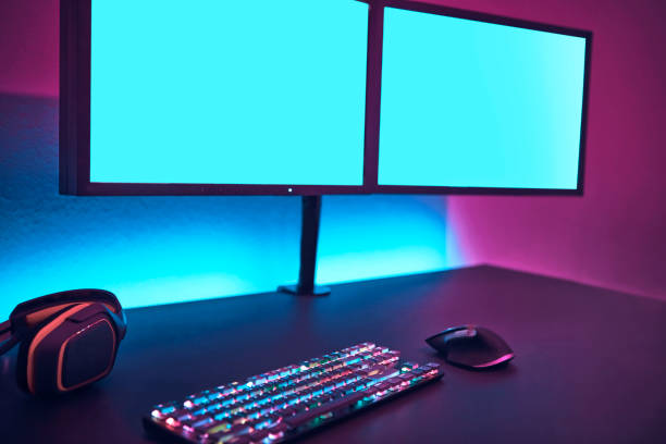 istock Male player using computer keyboard and mouse. Blank monitor to insert your content. 1334622623