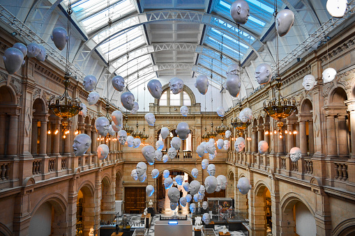 Glasgow, Scotland - Oct 2016: Temporary exposition: The Floating Heads by Sophie Cave in the East Court. The museum has 22 galleries, housing a range of exhibits, including Renaissance art, taxidermy, and artifacts from ancient Egypt.