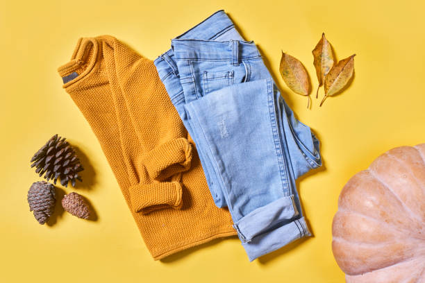 istock Kid autumn wear clothes on yellow 1334624655