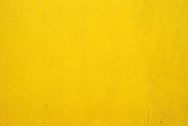 Photo of Flat yellow wall with small markings