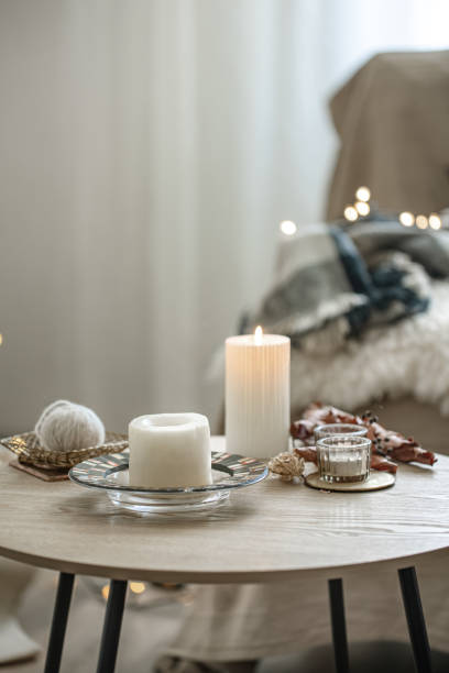 istock Cozy home composition with candles on blurred bokeh background. 1334626475