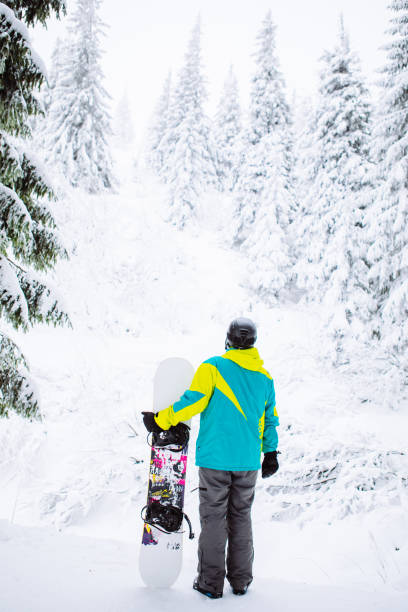 istock man snowboarder in ski equipment 1334626710