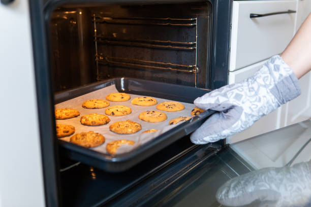istock woman baking cookies at the domestic kitchen 1334626937