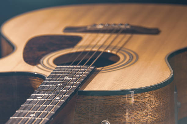 istock Close-up of a classical acoustic guitar on a black background. 1334627052
