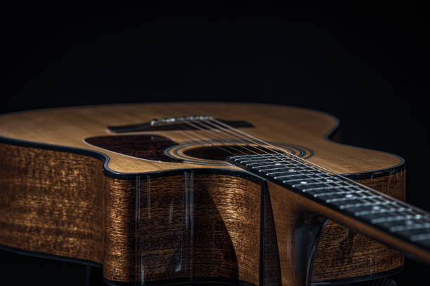 istock Close-up of a classical acoustic guitar on a black background. 1334627078