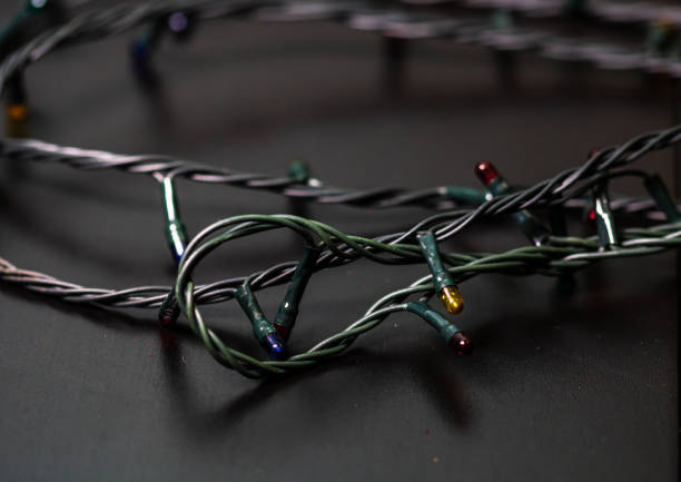 istock Christmas lights hanging in the Christmas tree 1334627779