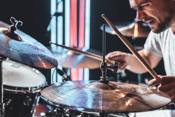 istock A male drummer plays drums with drum sticks. 1334628508