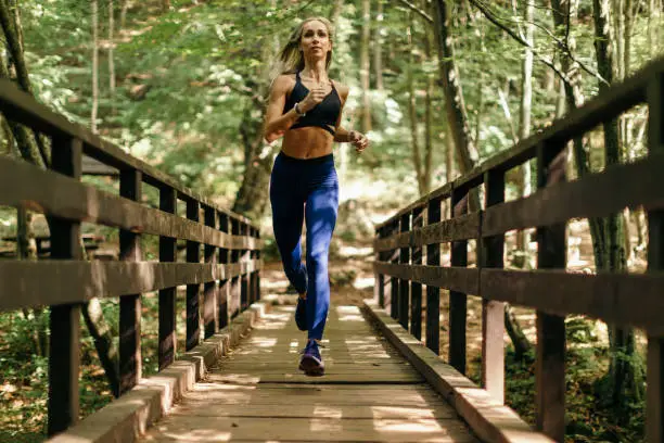 Photo of Very attractive mid adult woman exercising in nature