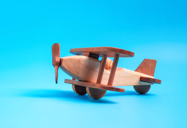istock Wooden toy airplane biplane on a blue background 1334629888