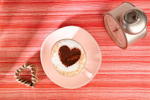 istock cappuccino with old alarm clock and heart on red 133463076