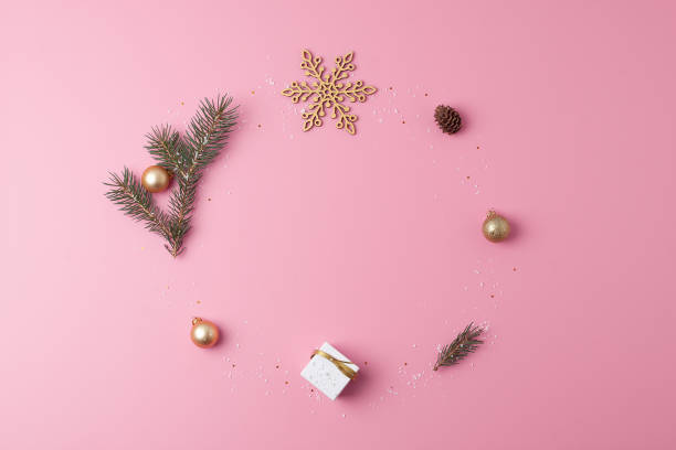 istock Christmas decorations with gift on pink background. Flat lay, copy space 1334631022