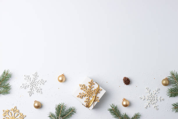 istock Christmas decorations with gift on white background. Flat lay, copy space 1334631050