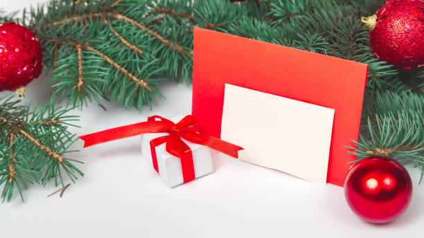 istock Christmas handmade gift boxes isolated on white background from above. letter in an envelope. Merry Christmas greeting card. holiday concept. Happy New Year. Flat lay 1334631347