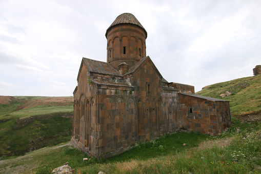 Kars, Turkey-June 6, 2019: Church ruins in a lush nature in the historical city of Ani.