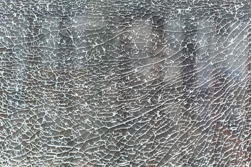 texture and background. cracked and broken glass into small fragments