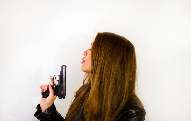 young beautiful woman with a gun