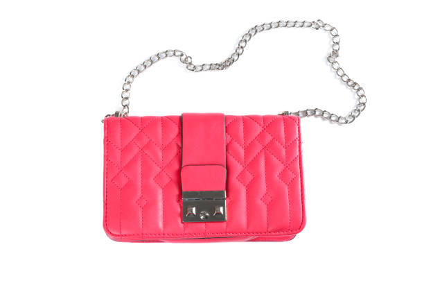 istock Stylish pink leather bag isolated on white, top view 1334639187