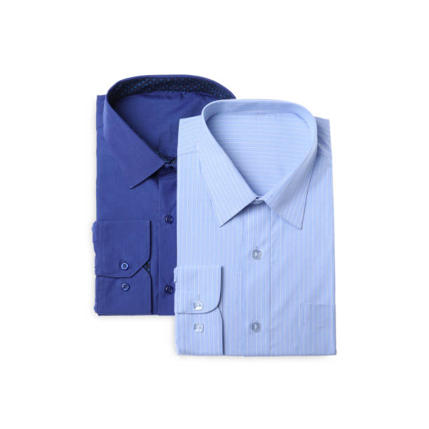istock Stylish shirts isolated on white, top view. Dry-cleaning service 1334639757